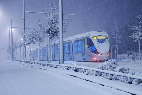 The Jerusalem Light Rail Train covered in Snow and still running!