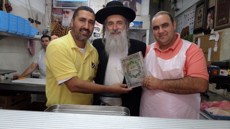 Emuna Outreach's "Strong Home-Front" Project: Merchants from Ashdod's outdoor market, hit in past by Hamas missiles, receiving Likutei Moharan from Rabbi Lazer - See more at: http://lazerbrody.typepad.com/lazer_beams/#sthash.LQUYjrt8.dpuf