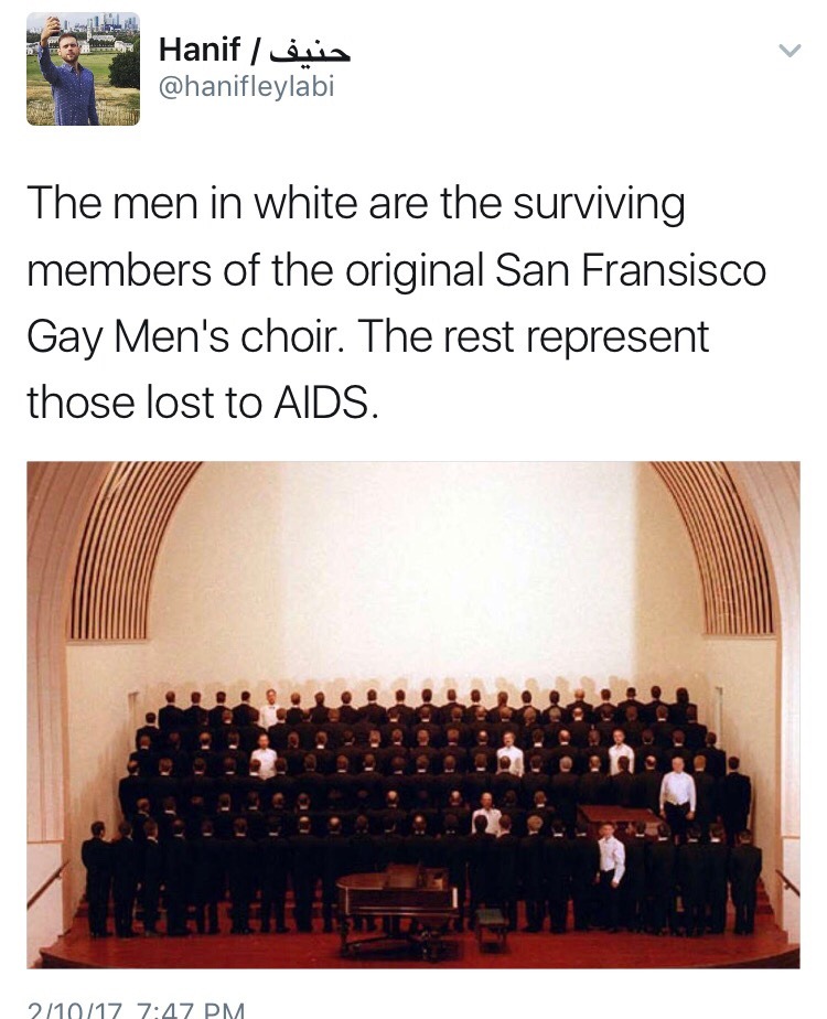 The men in white are the surviving members of the original San Francisco Gay Men's Choir. the rest represent those lost to AIDS.