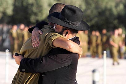 Unity in Israel: A Haredi Man giving a hug to an IDF Soldier