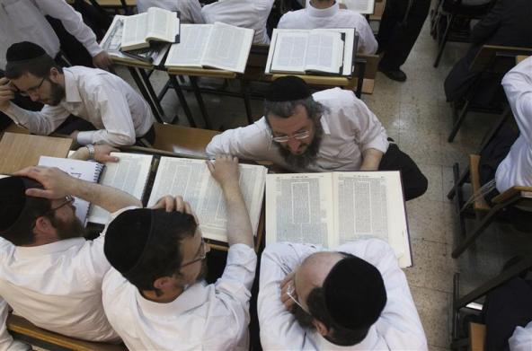 Ultra-Orthodox Jewish men study at Jerusalem's Mir Yeshiva, the largest Jewish seminary in Israel