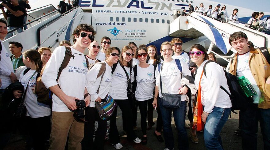 Participants of the Taglit-Birthright Israel flight pose for a picture as they arrive at Ben-Gurion International Airport | Photo: Courtesy