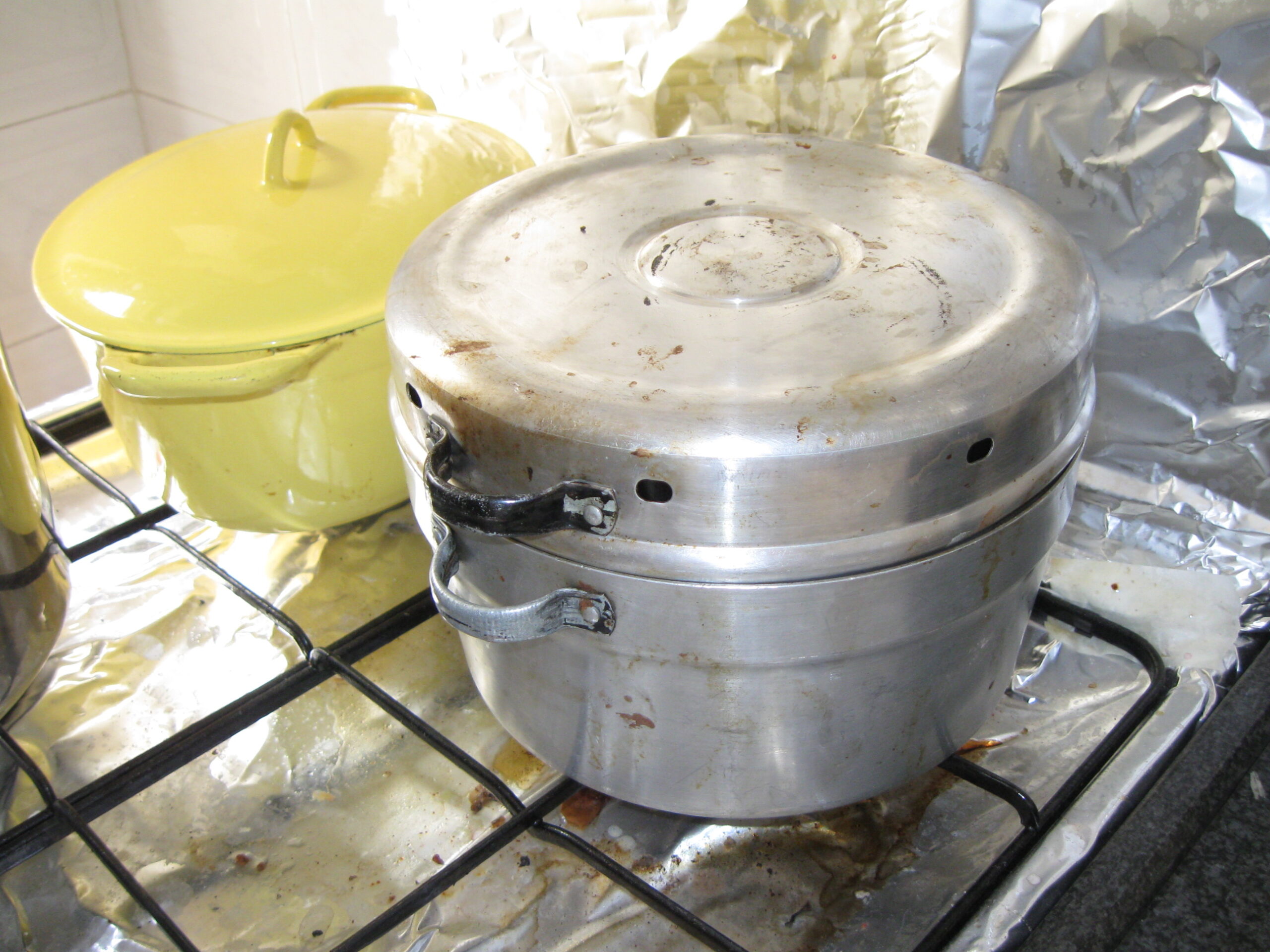 Wonder Pot - A Wonder Pot (right) on the stove