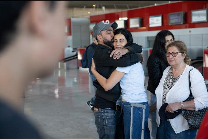 Yael Zeitoun says goodbye to family members at Charles de Gaulle Airport in Paris before she moves to Israel with her husband and two teenage sons.