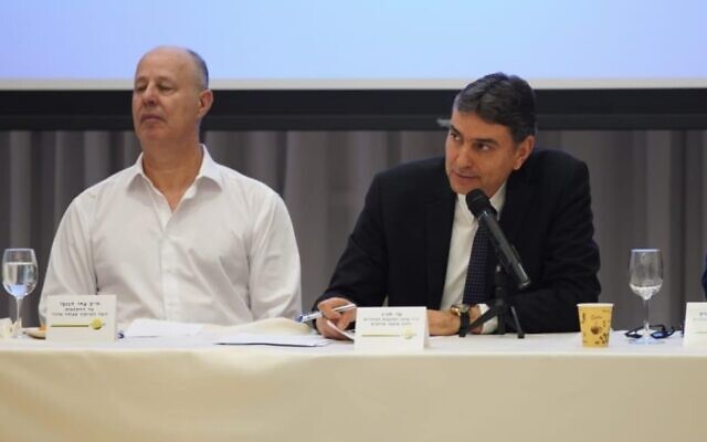 Agriculture Minister Tzachi Hanegbi (L) and Shai Hajaj, chairman of the Regional Councils Center and head of the Merhavim Regional Council in southern Israel, at an emergency confab about food production in the shadow of coronavirus, March 11, 2020. (Courtesy)