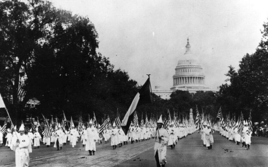 During the 1920s, members of the KKK march in Washington, DC (Public domain)