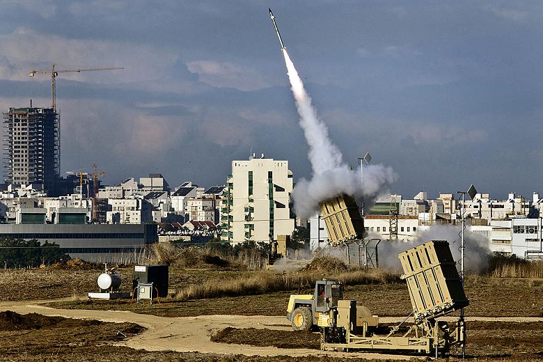 LONGSHOT: At a cost of as much as $100,000 per unit, Israel’s Iron Dome, seen here in action, has a rocket-interception rate of 85-90%. But it doesn’t cover the whole country—not by a longshot.