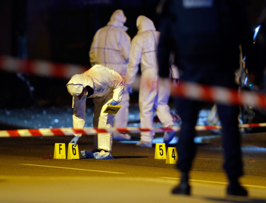 Investigating police officers work outside the Stade de France stadium, in Saint Denis, outside Paris, Friday Nov. 13.