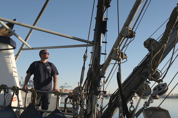 Corbin Hanson aboard the fishing boat Eileen at Terminal Island. (Gary Friedman / Los Angeles Times)