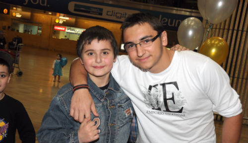 Stas, left, is reunited with his brother Danny, brought to Israel by CCOC last year.