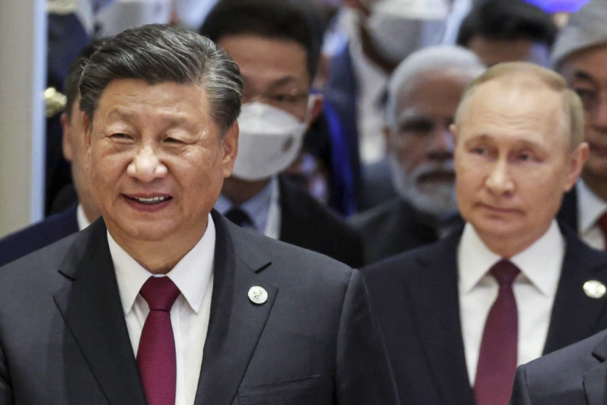 Chinese President Xi Jinping and Russian President Vladimir Putin in Uzbekistan on Friday via AP
