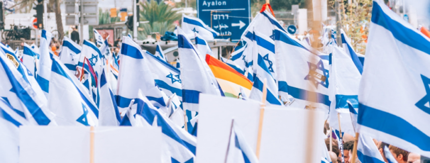 judicial reform - Israeli flags flying - Photo by <a href="https://unsplash.com/@yoavaziz?utm_source=unsplash&utm_medium=referral&utm_content=creditCopyText">Yoav Aziz</a> on <a href="https://unsplash.com/photos/uKz2BLGq8jg?utm_source=unsplash&utm_medium=referral&utm_content=creditCopyText">Unsplash</a> 