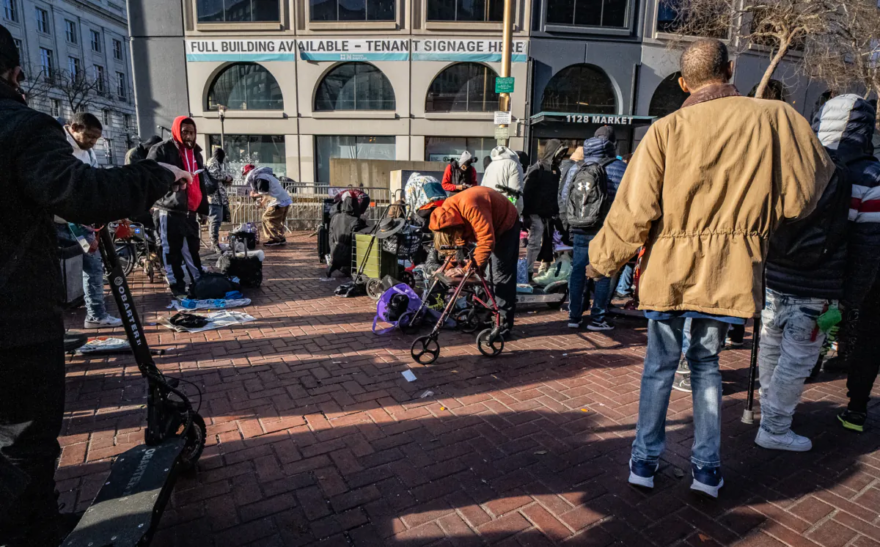 Homeless people gather near drug dealers in the Tenderloin District of San Francisco