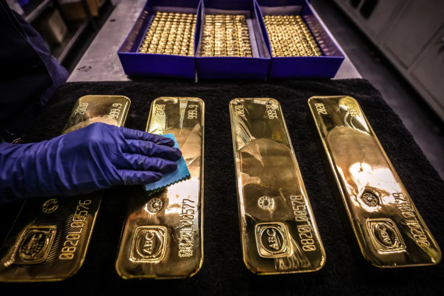 A worker polishes gold bullion bars at the ABC Refinery in Sydney on Aug. 5, 2020. Gold prices hit $2,000 an ounce on markets for the first time on Aug. 4, 2020. (David Gray/AFP via Getty Images)