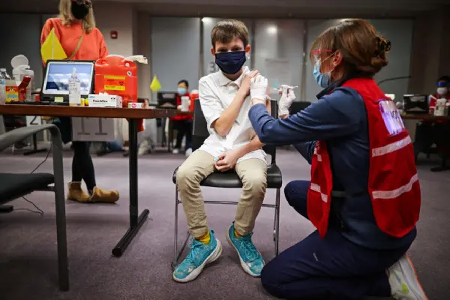 A child receives a dose of the Pfizer-BioNTech COVID-19 vaccine at the Fairfax County Government Center in Annandale, Va., on Nov. 4, 2021. (Chip Somodevilla/Getty Images)