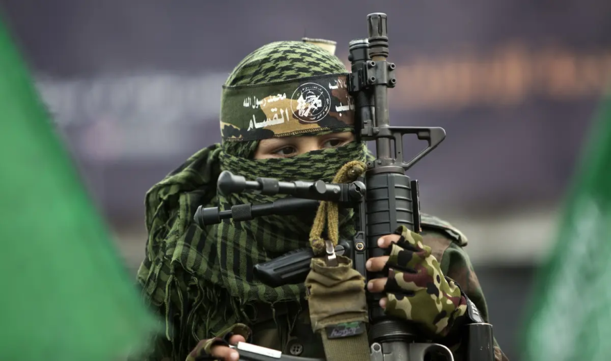 A young boy holds a U.S.-made M4A1 rifle during a rally of Hamas supporters, at the Jabalia refugee camp, Gaza Strip, on Dec. 12, 2014. (Mahmud Hams/AFP/Getty Images)