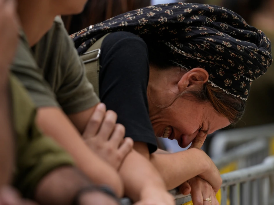 A woman cries during the funeral of Israeli Col. Roi Levy at the Mount Herzl cemetery in Jerusalem on Monday, Oct. 9, 2023. Col. Roi Levy was killed after Hamas militants stormed from the blockaded Gaza Strip into nearby Israeli towns. (AP Photo/Maya Alleruzzo) 
