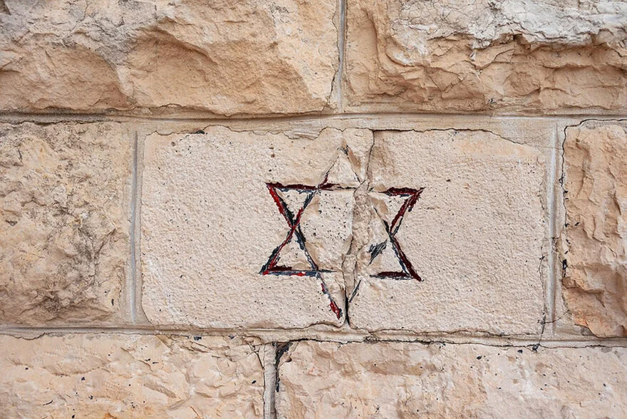 Jewish Star Of David on Brick Photo via: StandWithUs/Shutterstock