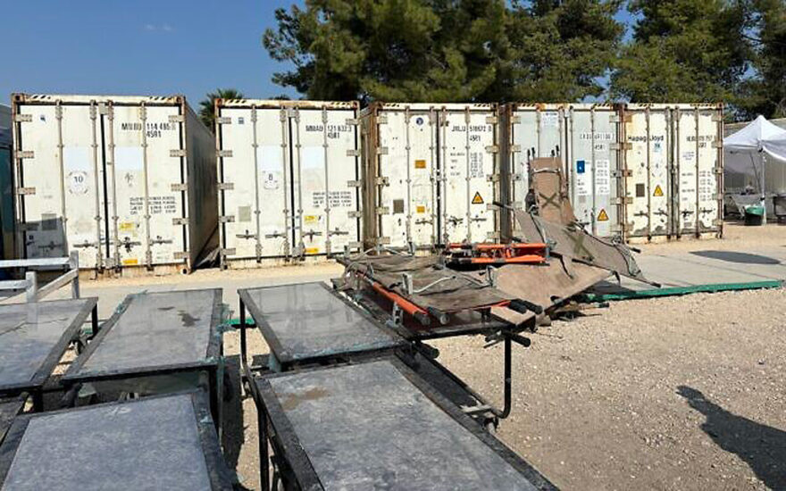 Refrigerated containers holding bodies at Israel’s makeshift mass casualty morgue at Shura Base, October 31, 2023. (Carrie Keller-Lynn/Times of Israel)