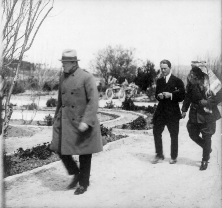 British Secretary of State for the Colonies, Winston Churchill, T.E. Lawrence “of Arabia,” and Emir Abdullah of Trans-Jordan walking in the gardens of the Government House, Jerusalem, during a secret conference on March 28, 1921, to discuss splitting the Mandate of Palestine and the formation of the Kingdom of Jordan west of the Jordan River. (Library of Congress)