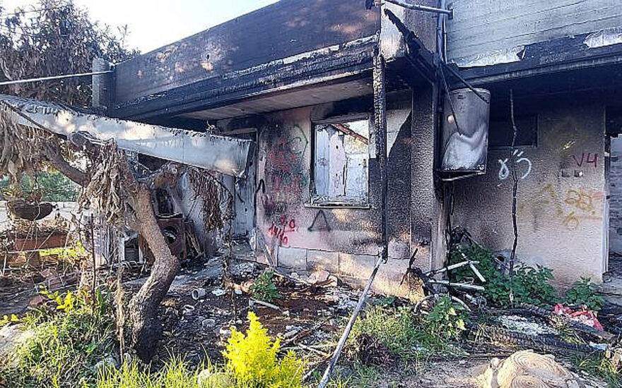 A ruined home in Kfar Aza’s young neighborhood. (Courtesy)
