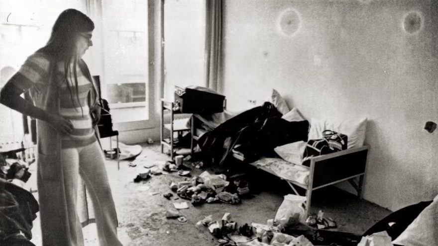 Ankie Spitzer, widow of the Israeli fencing coach, Andre Spitzer, surveys the room where the attack occurred at Munich's Olympic Village.