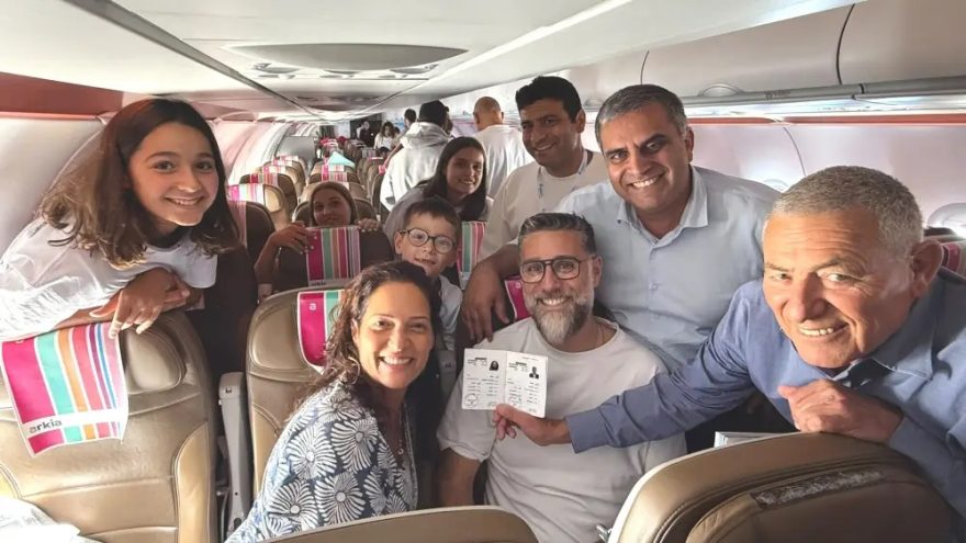 Doron Almog, chairman of the Jewish Agency (far right), and Ofir Sofer, Israeli Minister of Aliyah and Integration (to his left), with a family from France arriving to make their new home in Israel, Aug. 3, 2026. Credit: Courtesy of the Jewish Agency.