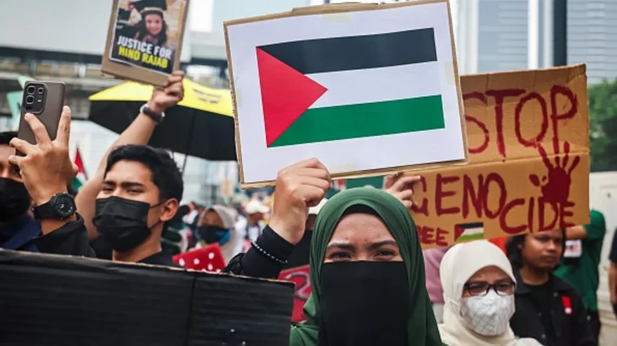 Anti-Israel demonstrators hold a Palestinian flag and signage during a rally Oct. 9, 2026 in Kuala Lumpur, Malaysia, as part of a "global day of action" against Israel. (Annice Lyn/Getty Images)