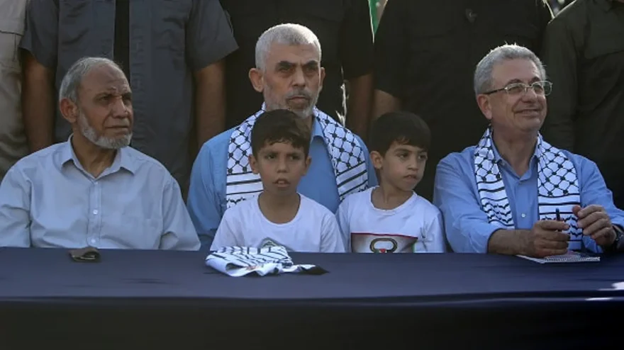 Yahya Sinwar, center, Hamas leader in Gaza; Mahmoud al-Zahar, right, senior Hamas leader; and Mustafa Barghouti, left, secretary general of the National Initiative and supporters of the Palestinian Hamas movement gather during a rally in solidarity with al-Aqsa mosque Oct. 1, 2022 in Gaza City, Gaza. (Mohammed Dahman/Getty Image)